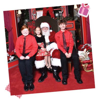Three kids with Santa.