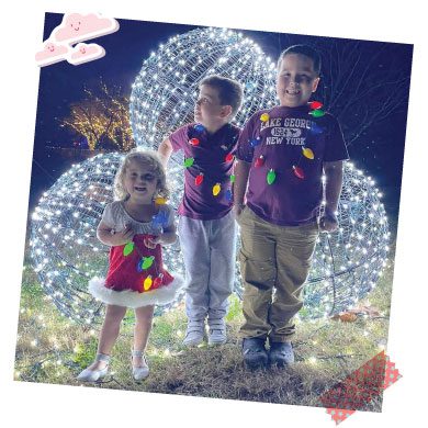 Three kids with lights.