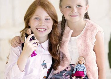 Girls with mini dolls.