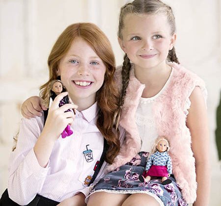 Girls with mini dolls.