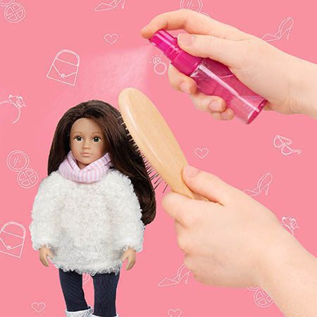 Mini doll getting her hair brushed.