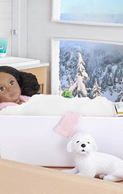 Mini doll in tub.