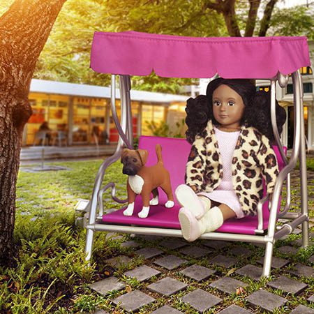 Mini doll sitting with dog.