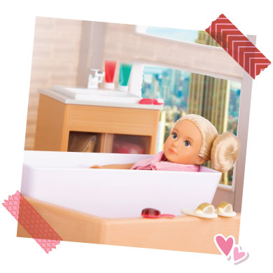 Mini doll in tub.