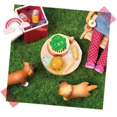 Doll outside with food and dogs.