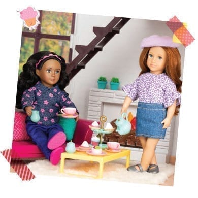 Two dolls having a tea party.