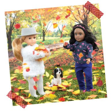 Dolls playing with fall leaves.