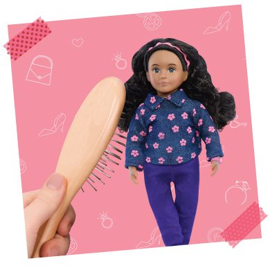Mini doll getting her hair brushed.