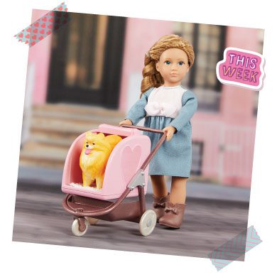 Doll with puppy in a stroller.