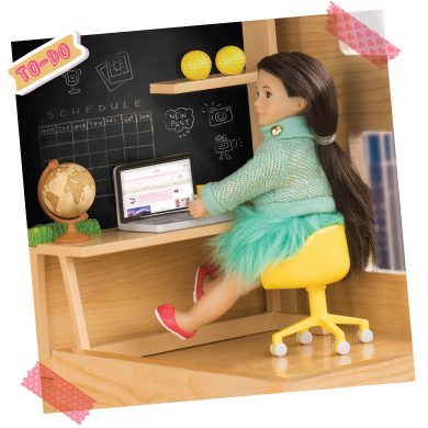 Mini doll at computer.