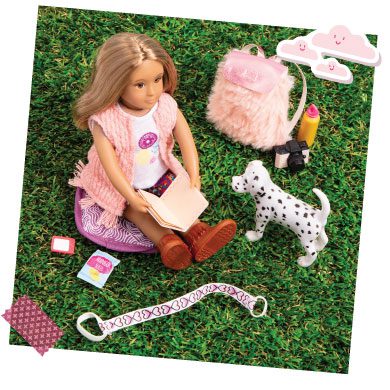 Mini doll reading outside.