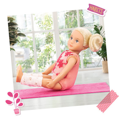 Mini doll doing yoga.